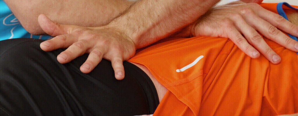 Athlete doing therapeutic massage to optimize performance